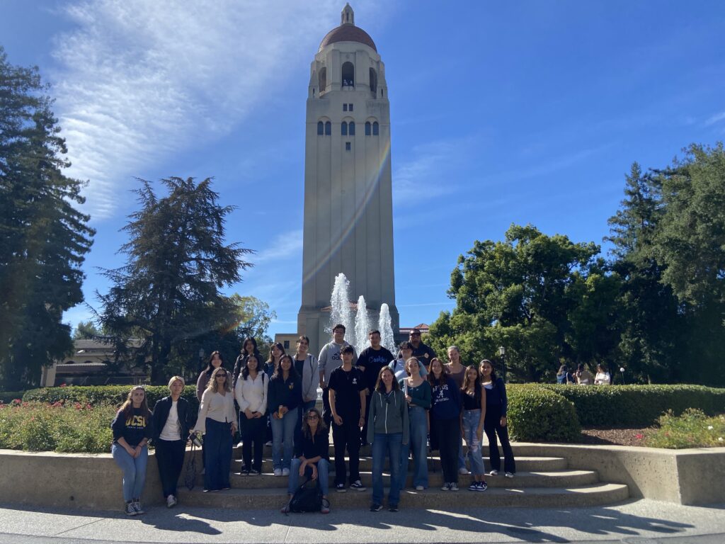 DIG CAMP students stand in front of Hoover Tower at Stanford University